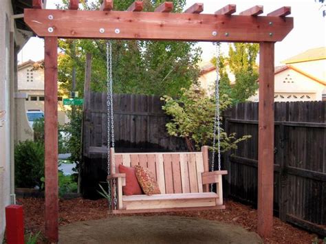 It features a slide, a big tower with a chevron roof, a swing set. DIY Outdoor Swings