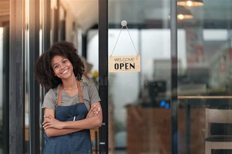 Successful African Woman In Apron Standing Coffee Shop Door Happy