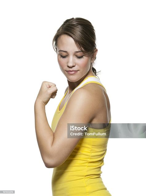 Healthy Young Woman Admiring Her Bicep Muscle Stock Photo Download