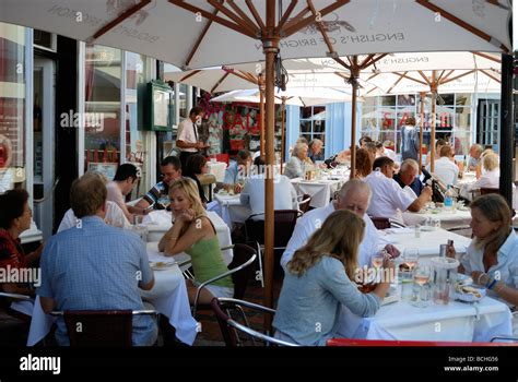Diners Sitting Outside A Restaurant Stock Photo Alamy