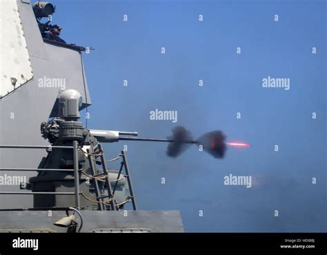 An Mk 38 25mm Gun System Is Fired During A Live Fire Exercise Aboard