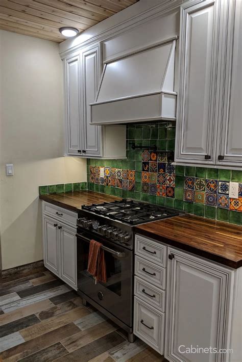 Shop the finest authentic rustic furniture, mexican furniture, talavera tile and pottery, mexican tin mirrors, and more. Transitional White Kitchen with a Mexican Tile Backsplash ...