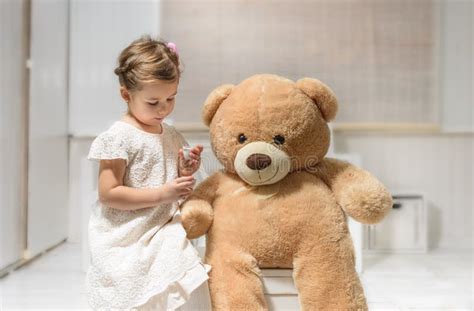Little Girl Playing With Teddy Bear Stock Photo Image Of House