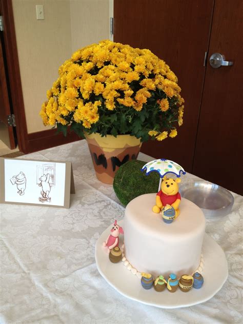 Brought to you by @disney. Winnie the Pooh baby shower flower center piece | Baby ...