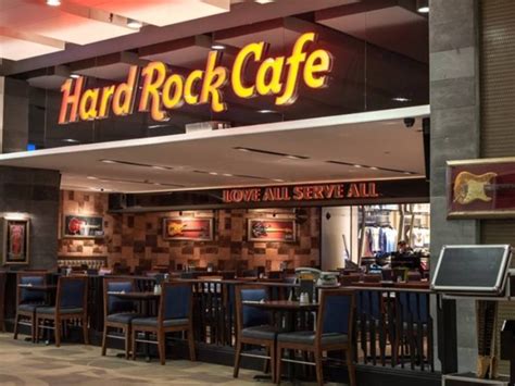 Is drinking a carlsberg by carlsberg group at hard rock cafe kota kinabalu. Hard Rock Cafe Kota Kinabalu