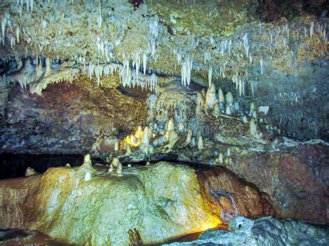Cave With Hanging Stalactites And Stalagmites On Rocks Barbados Island