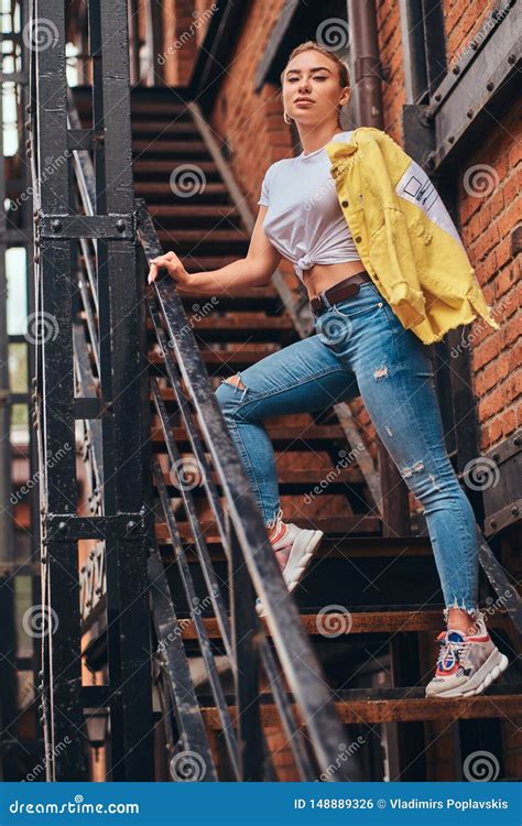 Cheeky Woman Is Posing For Photographer On Stairs To Her Own Flat