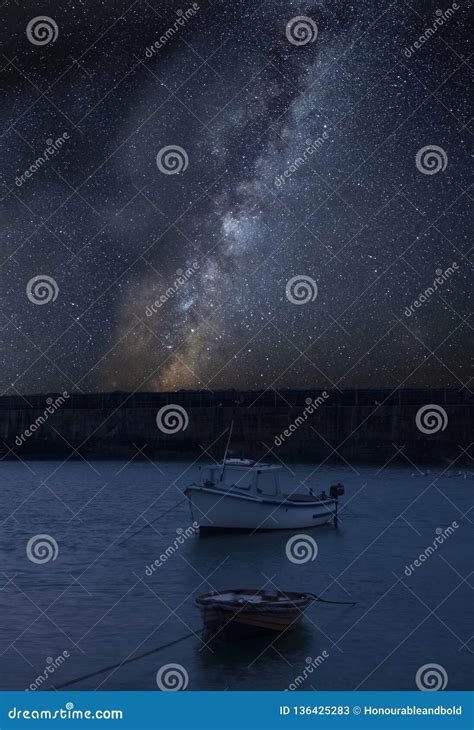 Vibrant Milky Way Composite Image Over Landscape Of Fishing Boats In