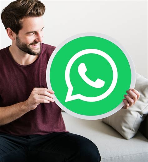 Free Photo Cheerful Man Holding A Whatsapp Messenger Icon