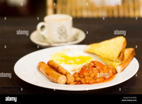 American Or Western Breakfast Sausages Fried Egg Beans And Toasts