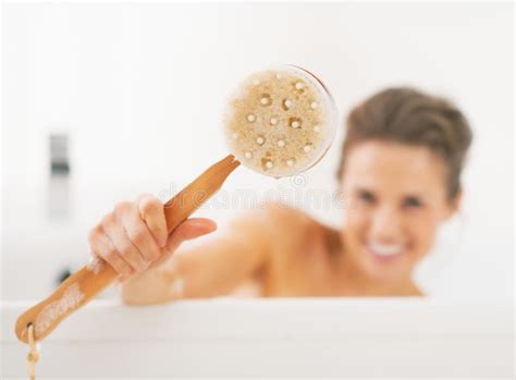 Young Woman Washing With Body Brush In Bathtub Stock Image Image Of