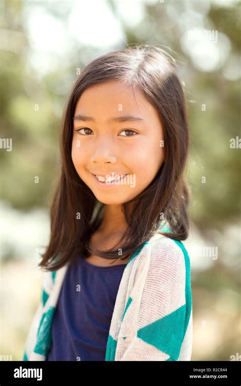 Portrait Of A Young Asian Girl Smiling Outside Stock Photo Alamy