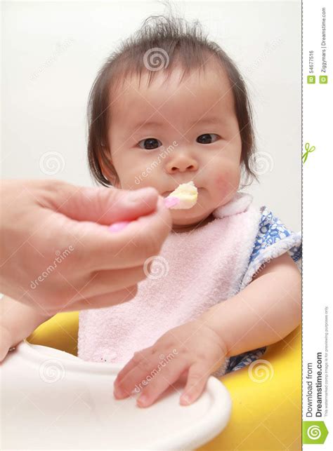 Japanese Baby Girl Eating Baby Food Stock Photo Image Of Baby Child