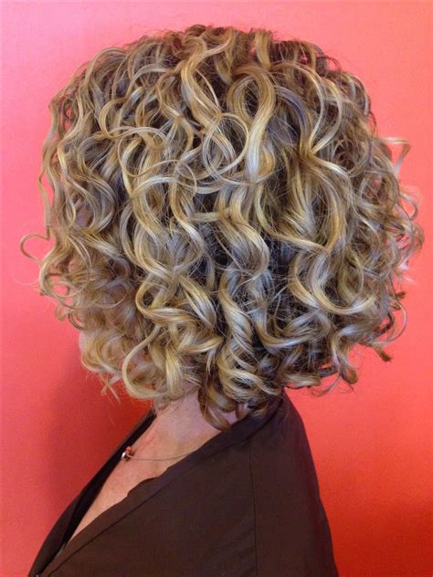 Rounded layers suit a square face shape, while round face shapes can. Short permed hair, Curly hair styles, Hair styles