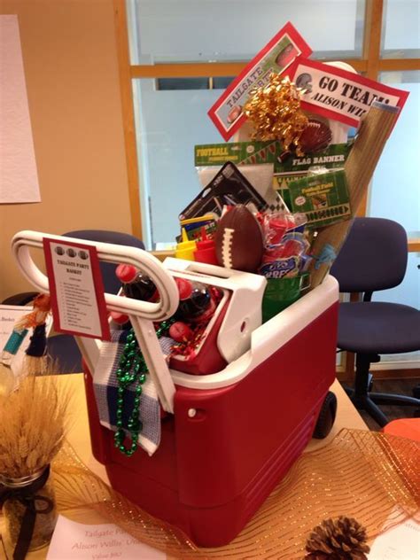 These sports gift ideas are perfect for the gym, the game, and supporting his favorite team. Tailgate Gift Basket | Homemade gift baskets, Auction baskets
