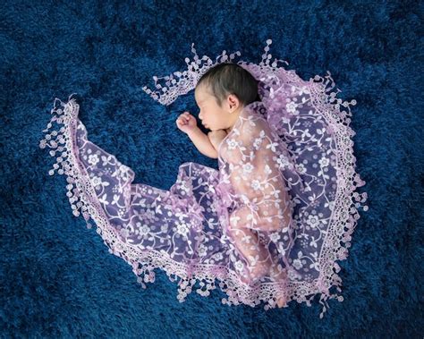 Premium Photo Newborn Cute Baby Infant On Blue Wool Shag Rug Background