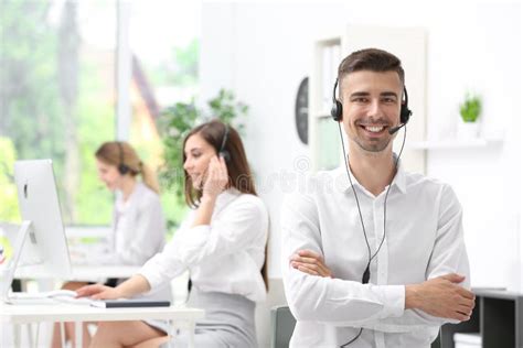 Young Male Receptionist With Headset Stock Photo Image Of Colleague