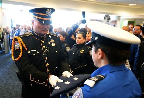 Laxpd Honor Guard Ofc Dye Delivering Us Honor Flag To Tsa Honor Guard