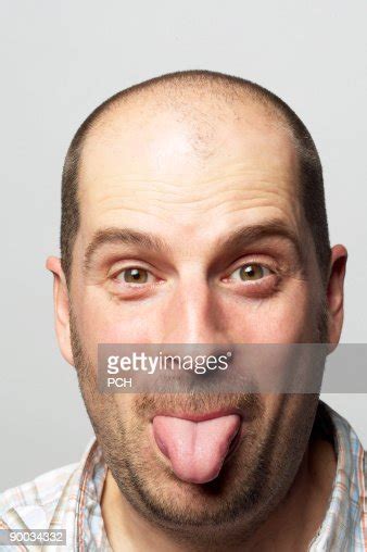 Bald Man Sticking Out His Tongue Stock Foto Getty Images