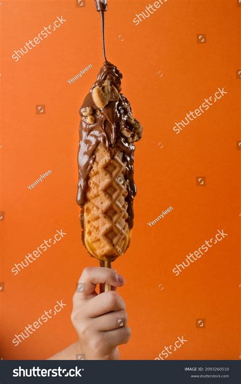 Hand Holding Waffle Stick Chocolate Glazed Stock Photo 2093260510
