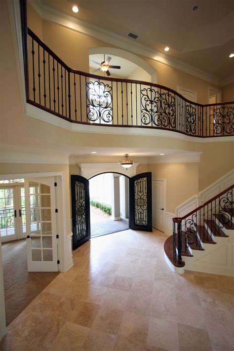 Amazing Open Foyer With Beautiful Stair Case And Balcony