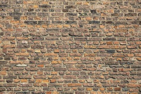A Rustic And Old Looking Brick Wall With Textured Brickwork Stock Image