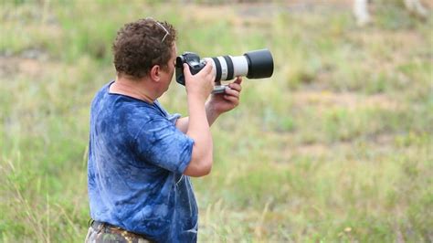 Photographer Working In The Field Free Stock Video