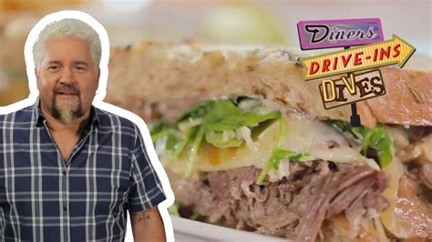 guy fieri eats a dynamite short rib sandwich diners drive ins and dives food network youtube