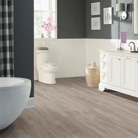 Trafficmaster allure flooring is a popular option for many remodels because it is waterproof, durable, and easy to install. TrafficMaster Taupe Oak 6 in. x 36 in. Peel and Stick Vinyl Plank (36 sq. ft. / case)-WD6841 ...