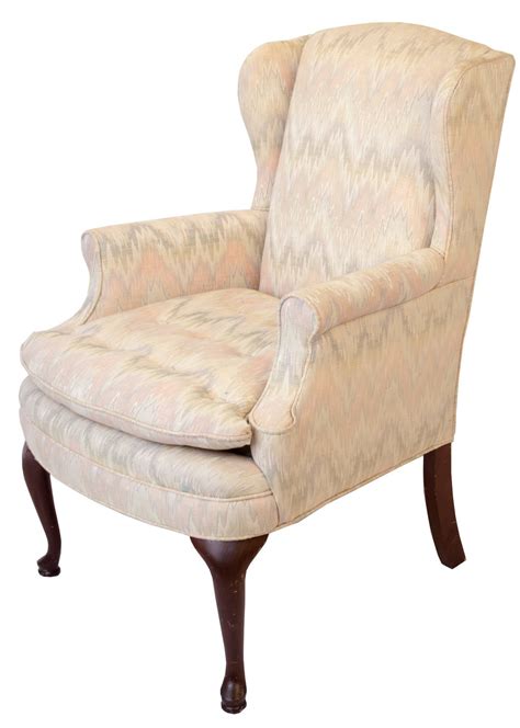 A wingback chair in the queen anne style. Queen Anne Style Upholstered Wing Chair For Sale at 1stDibs