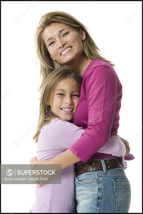 Portrait Of A Daughter Hugging Her Mother Superstock