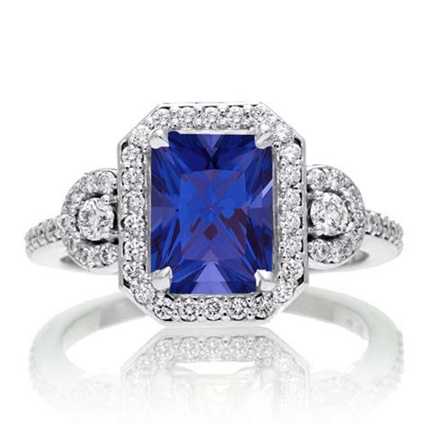 2 Carat Emerald Cut Sapphire And White Diamond Halo Engagement Ring On