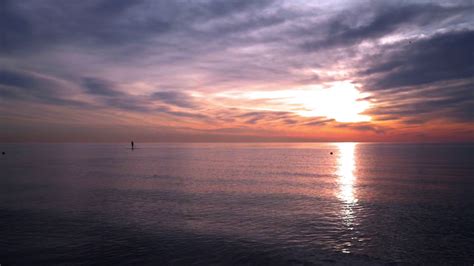 Ocean Sunset Man On Surfboard At Sunset Ocean Sunset At Ocean With