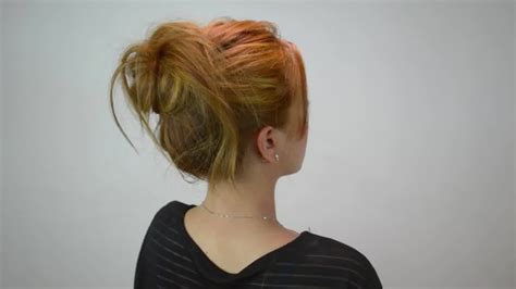 Pull hair to the front to avoid a smooth ponytail look. How to Do a Messy Bun (for Curly Hair) - 6 Easy Steps