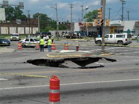Driver Rescued After Car Falls Into Ohio Sinkhole CBS News