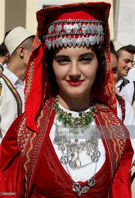 An Albanian Dancer In Traditional Costume Waits For The Start Of A