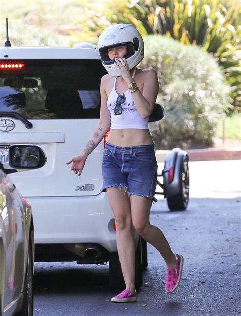 Miley Cyrus Turns Biker Chick As She Rides Huge Motorcycle In Tiny Crop