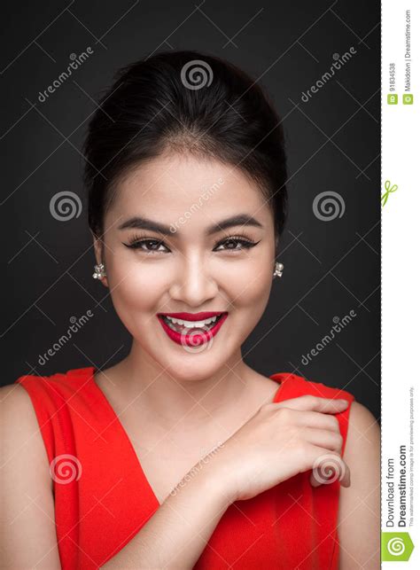 closeup of beautiful girl with bright makeup and red lips beauty fashion asian woman stock