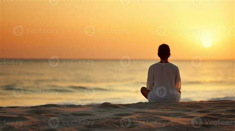 AI generated A woman meditating on the beach at sunset, finding inner
