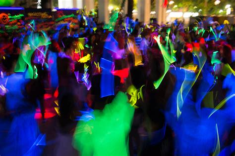 People Dancing In A Glow In The Dark Party Stock Photo Download Image