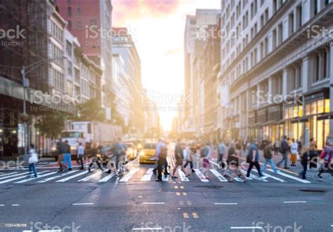 Busy Intersection In Manhattan New York City With Crowds Of Diverse