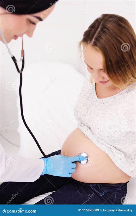 Doctor Gynecologist Examines A Pregnant Woman With A Large Belly Stock Image Image Of