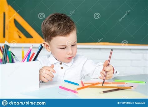 Surprised Cute Chil Writing In Notebook Using Pencil Schoolboy Boy