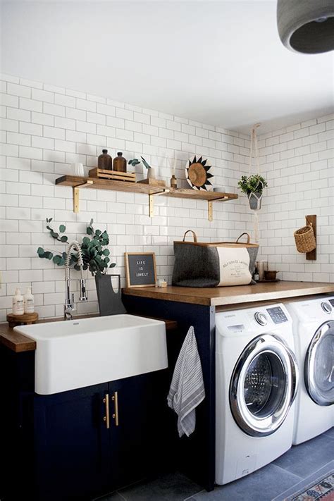 Elevate your laundry room to the same level as the rest of your home by incorporating moldings, specialty fronts and other solid wood details in cherrywood. Modern Navy Laundry Room Refresh | brepurposed | Laundry ...