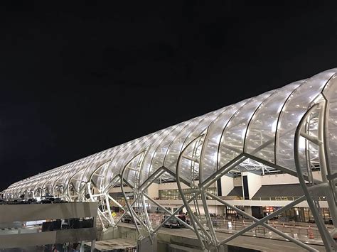 An Airport Terminal At Night With The Lights On