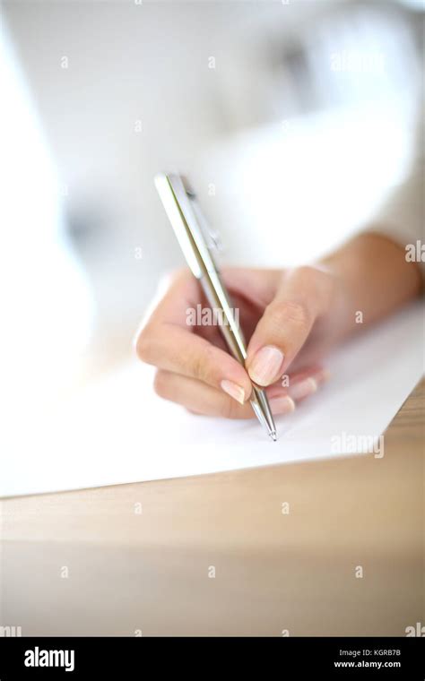 Closeup Of Womans Hand Writing On Paper Stock Photo Alamy