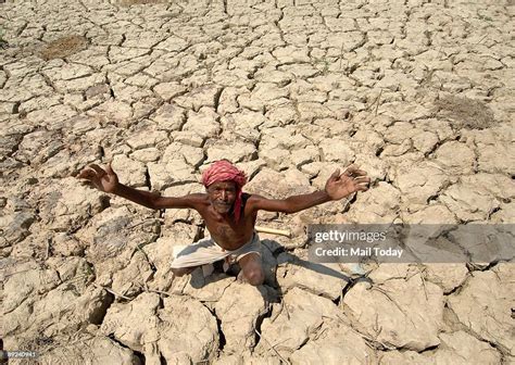A Farmer Looks At The Sky In Hope Of Some Rain In Patna Bihar On
