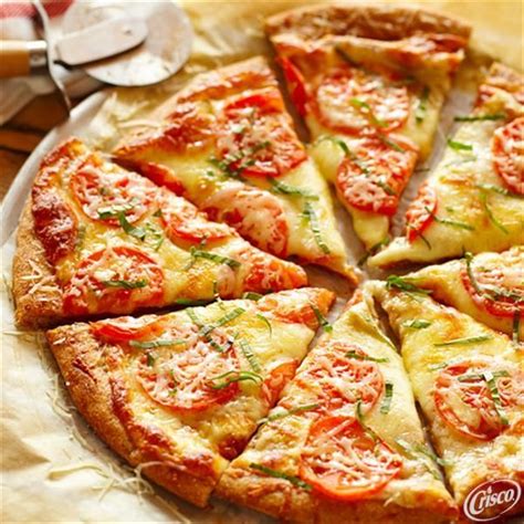 Homemade margherita pizza is a light, fresh pizza with olive oil, garlic, fresh tomatoes, basil, ricotta and mozzarella cheeses. Garlic Margherita Pizza from Crisco® | Pizza recipes easy ...