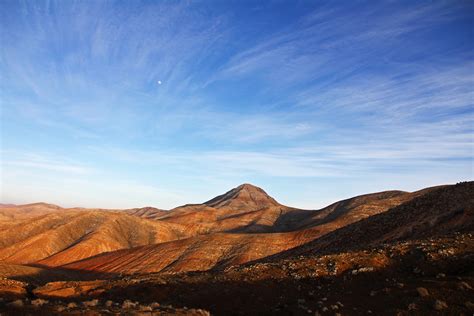 Blue Sky Under Brown Mountain · Free Stock Photo