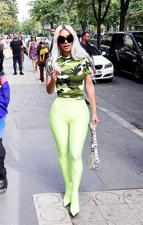 Kim Kardashian Rocks Skintight Neon Green Pants And Camo Top At Paris Fashion Week Photos Zonettie